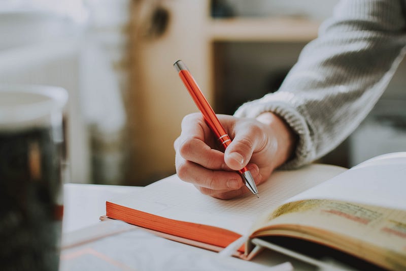 A person journaling in a serene environment